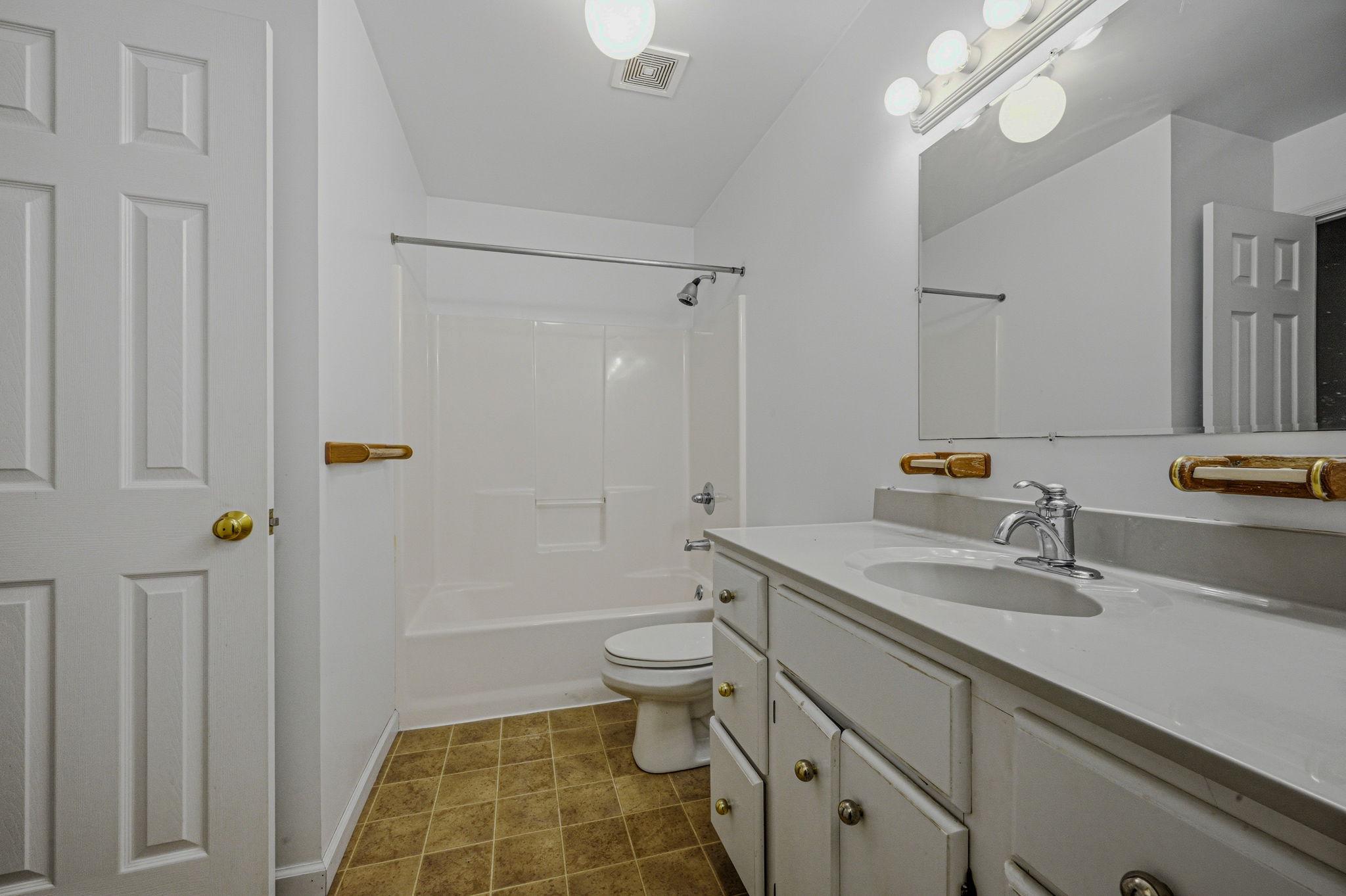 812 Taylors Bridge Road Townsend, DE 19734 - Photo 22 of 45 a bathroom with a sink a toilet and shower