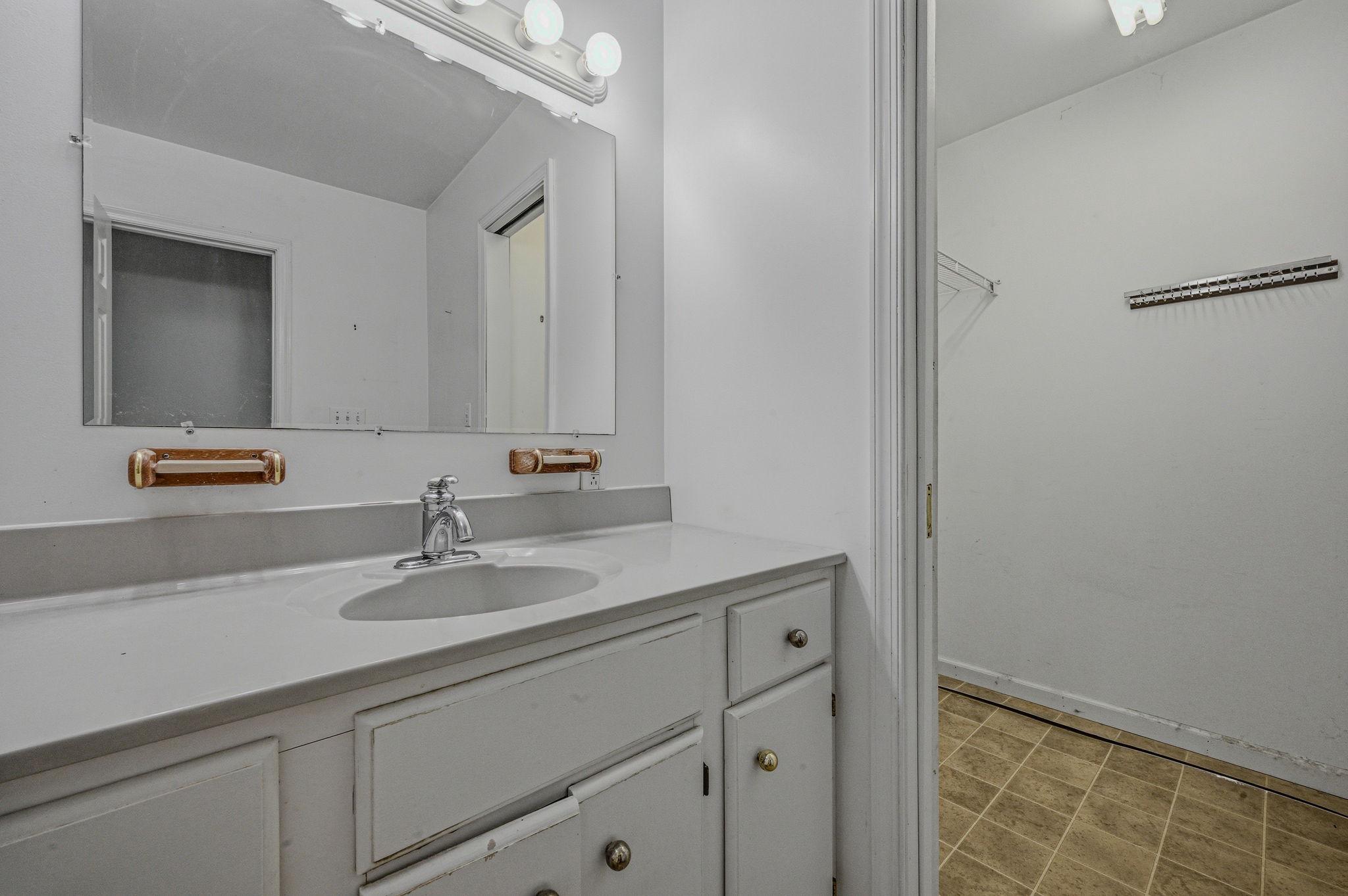 812 Taylors Bridge Road Townsend, DE 19734 - Photo 23 of 45 a bathroom with a sink and a mirror