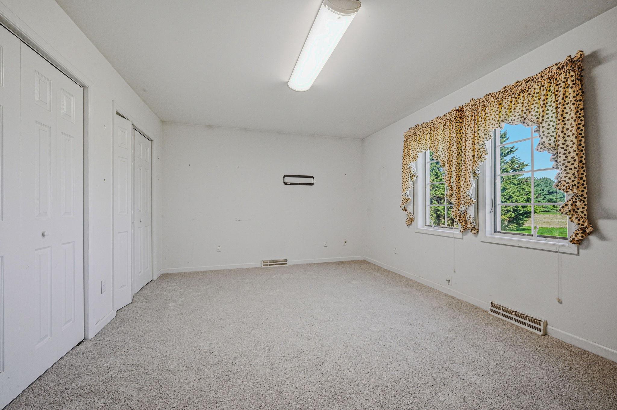 812 Taylors Bridge Road Townsend, DE 19734 - Photo 29 of 45 an empty room with windows