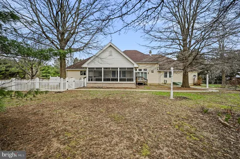 a house with trees in front of it
