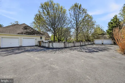 a view of a house with a yard and garage