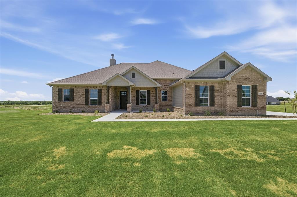 136 Hillview Trail Decatur, TX 76234 - Photo 1 of 26 Brick and siding exterior with a covered entry, gabled rooflines, and dark window shutters