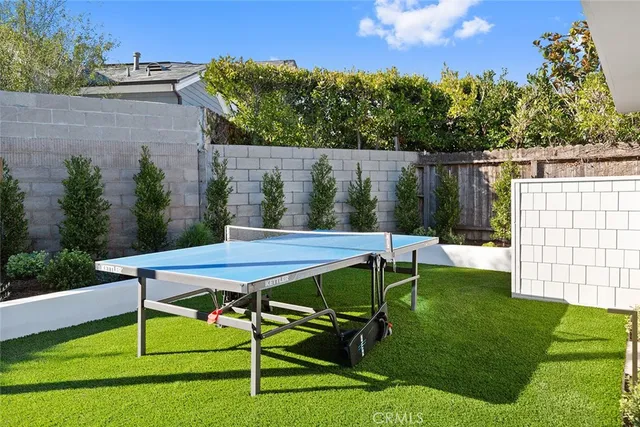 a view of a chairs and table in the yard