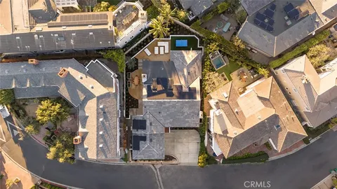 an aerial view of a residential apartment building with a yard