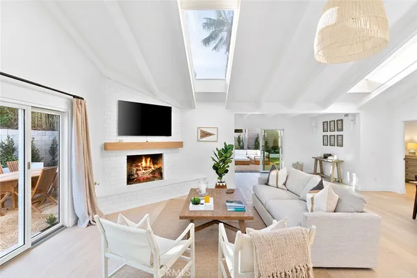 a living room with fireplace furniture and a flat screen tv