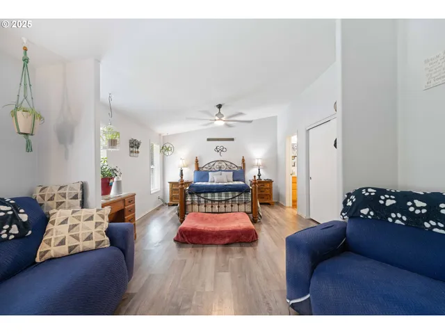 a bedroom with a bed window and couch