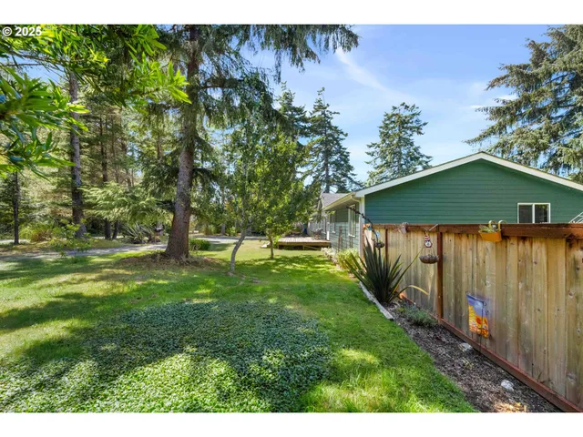 a view of a house with swimming pool and sitting area