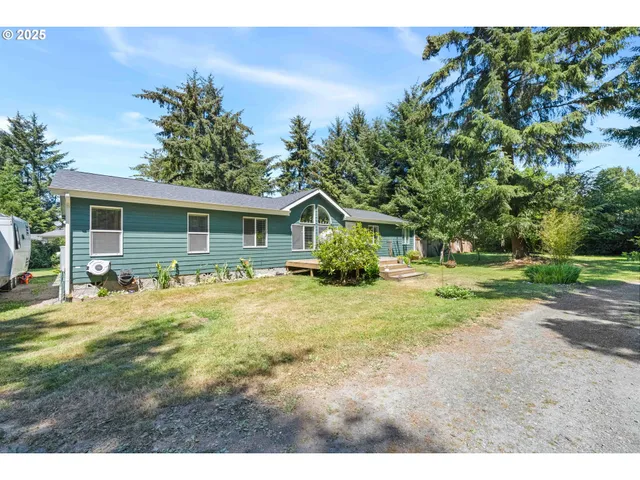 a view of a yard with swimming pool