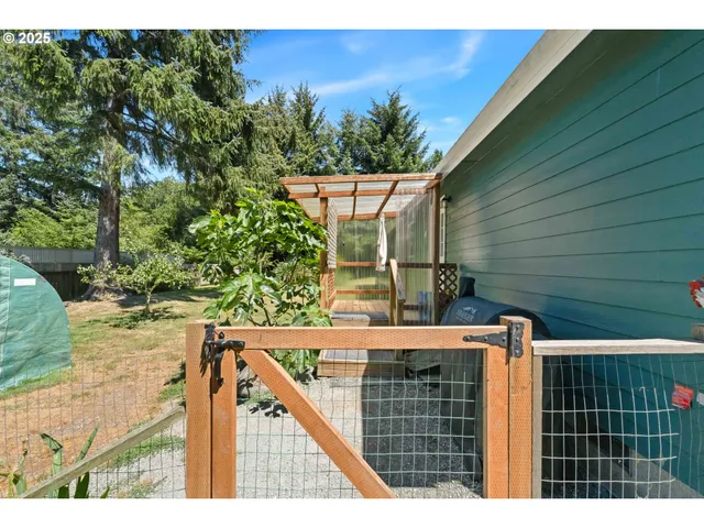 a view of a wooden fence with furniture