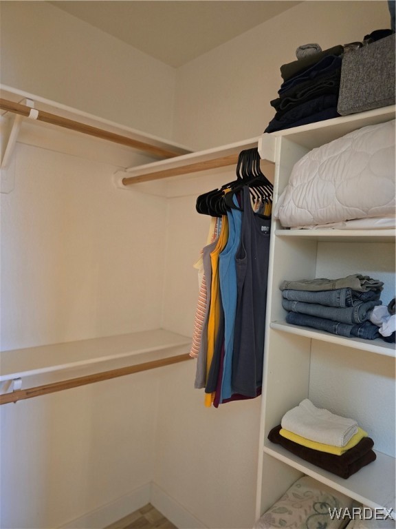 2374 Guthrie Road Golden Valley, AZ 86413 - Photo 53 of 84 a view of walk in closet with clothes and shoes