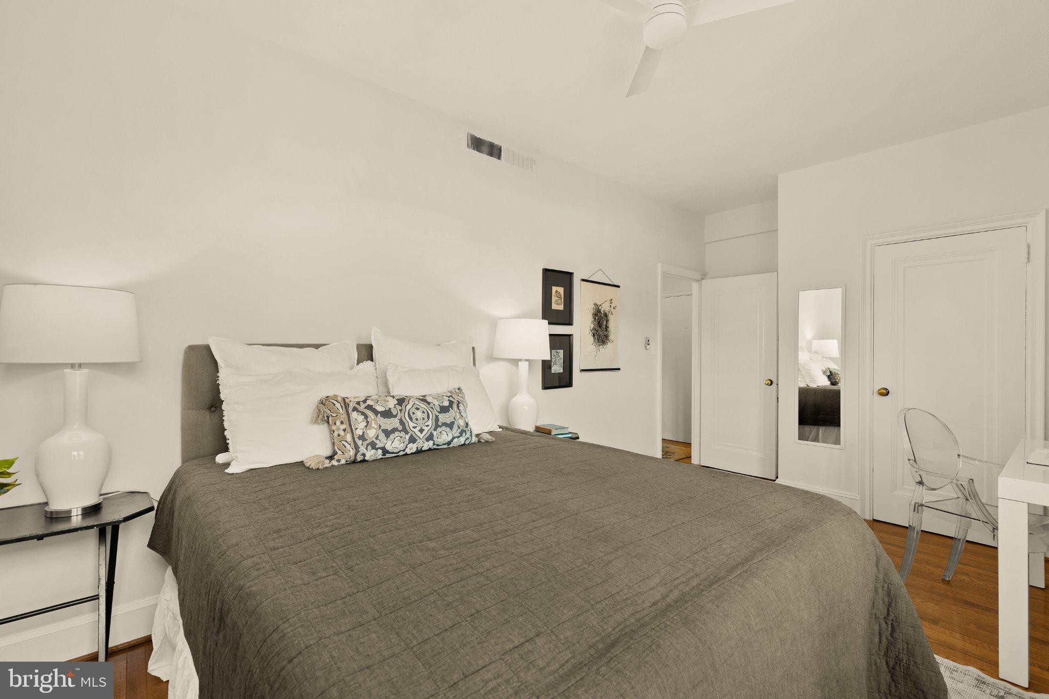 644 Massachusetts Avenue Northeast, Unit 400 Washington, DC 20002 - Photo 16 of 24 a bedroom with a bed and chair