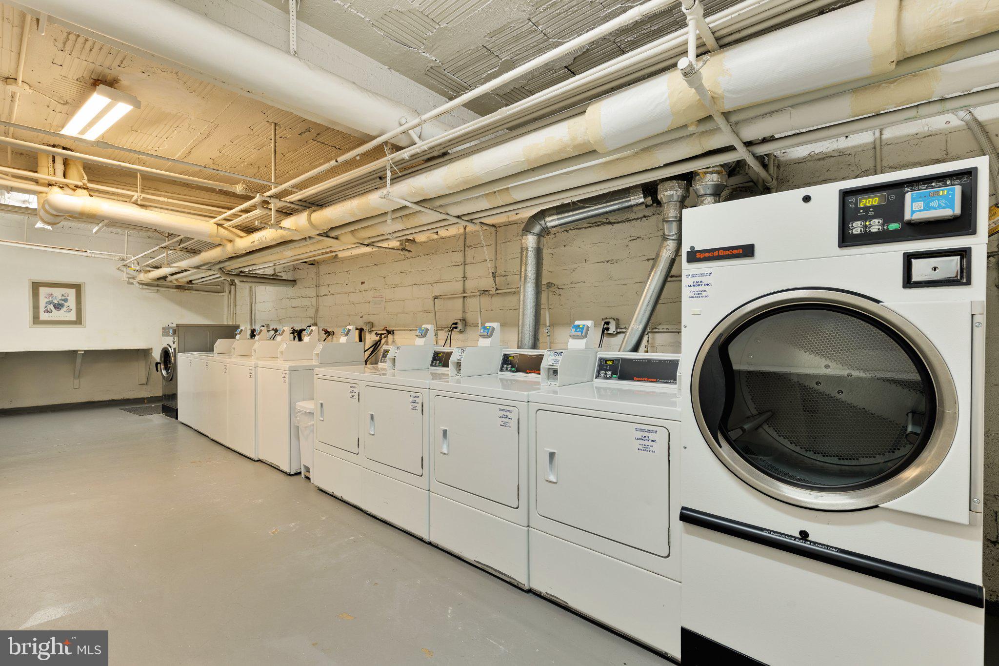 644 Massachusetts Avenue Northeast, Unit 400 Washington, DC 20002 - Photo 21 of 24 a utility room with dryer and washer