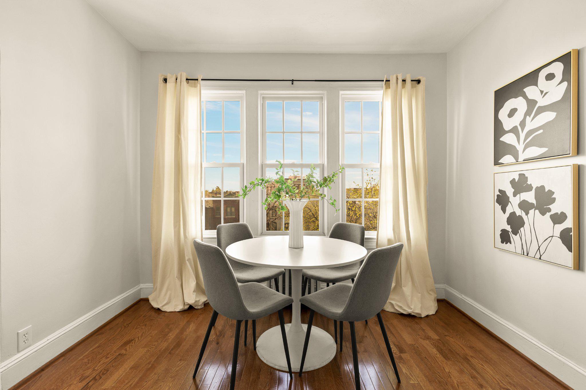 644 Massachusetts Avenue Northeast, Unit 400 Washington, DC 20002 - Photo 9 of 24 a view of a dining room with furniture window and wooden floor