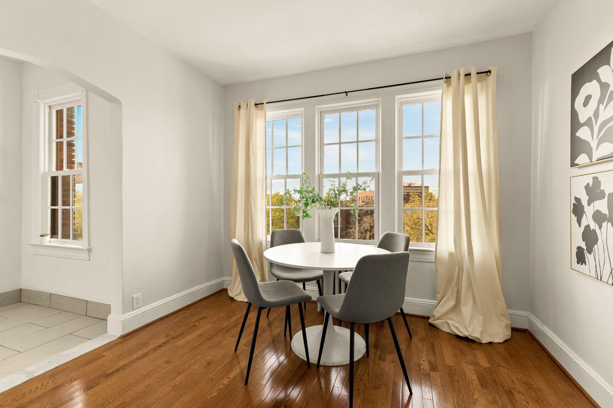 644 Massachusetts Avenue Northeast, Unit 400 Washington, DC 20002 - Photo 10 of 24 a view of a dining room with furniture window and wooden floor
