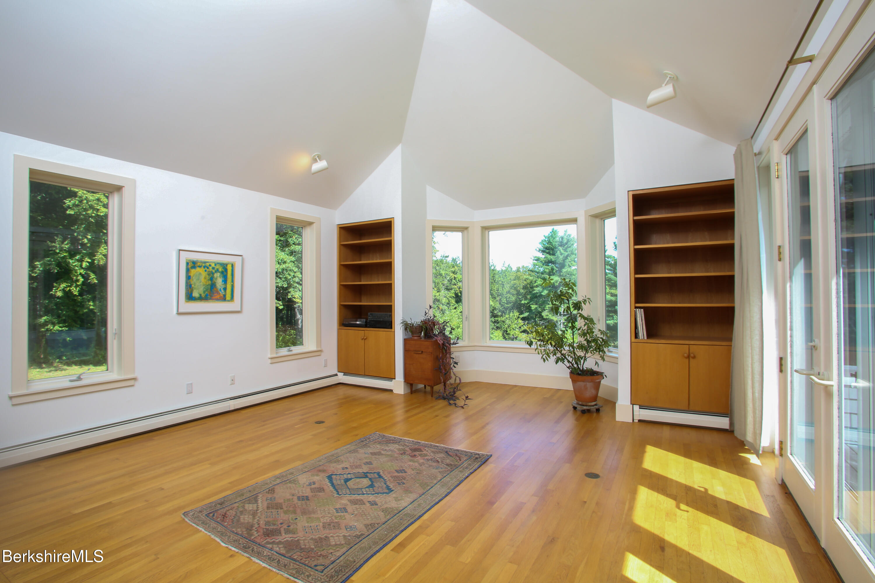 240 Beldingville Road Ashfield, MA 01330 - Photo 11 of 45 a view of an empty room with a window and wooden floor