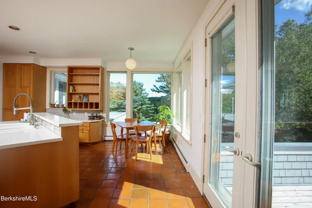 a view of a living room and dining room