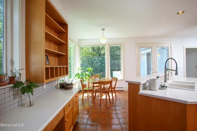 a dining room with furniture window and natural light