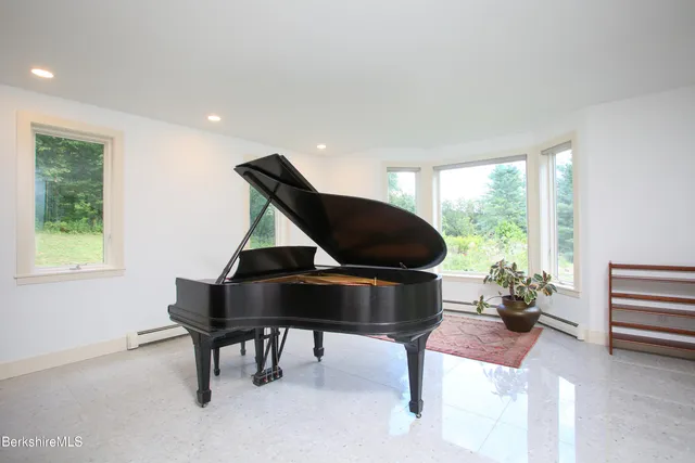 a couch sitting in a room next to a window