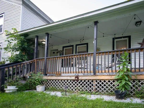a view of a house with a small yard