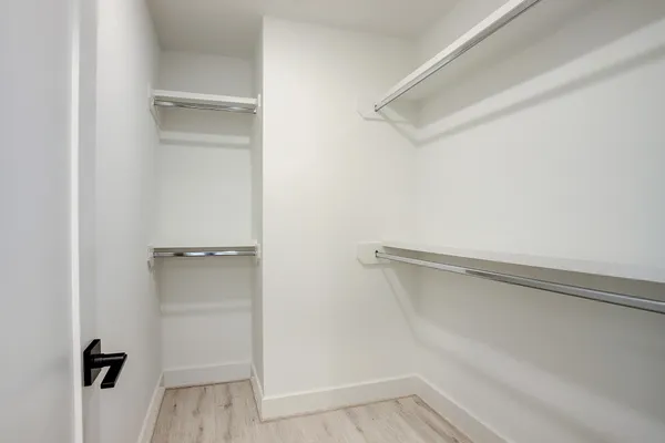 a view of an empty walk in closet