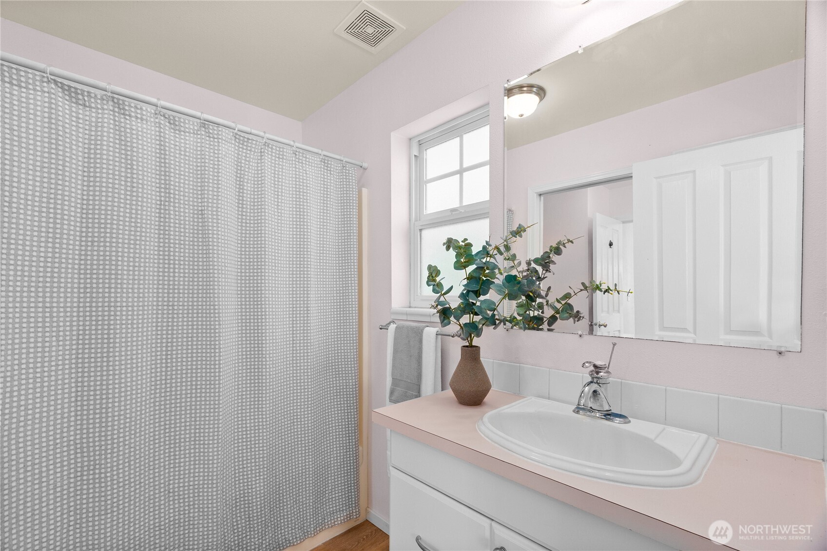 101 Briar Rose Lane Chehalis, WA 98532 - Photo 21 of 40 a bathroom with a sink a mirror and a shower curtain