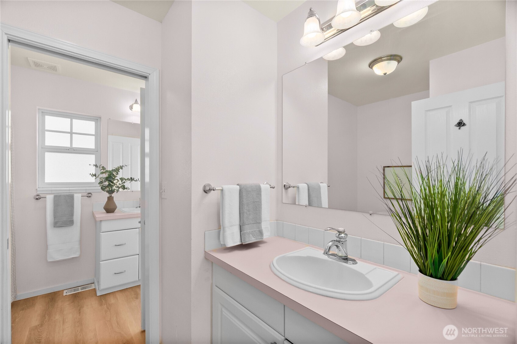 101 Briar Rose Lane Chehalis, WA 98532 - Photo 22 of 40 a bathroom with a sink a mirror and a potted plant