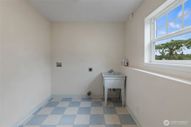 a bathroom with a toilet a sink and a window