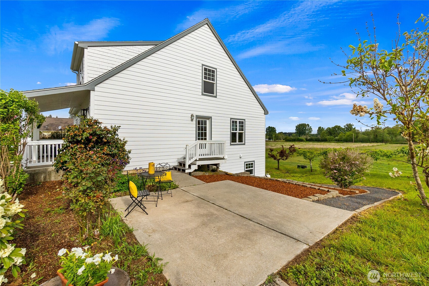 101 Briar Rose Lane Chehalis, WA 98532 - Photo 9 of 37 a backyard of a house with lake view and a potted plants