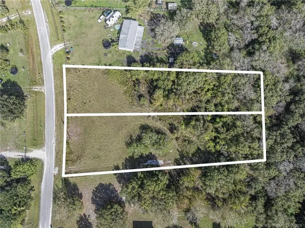an aerial view of residential house with outdoor space