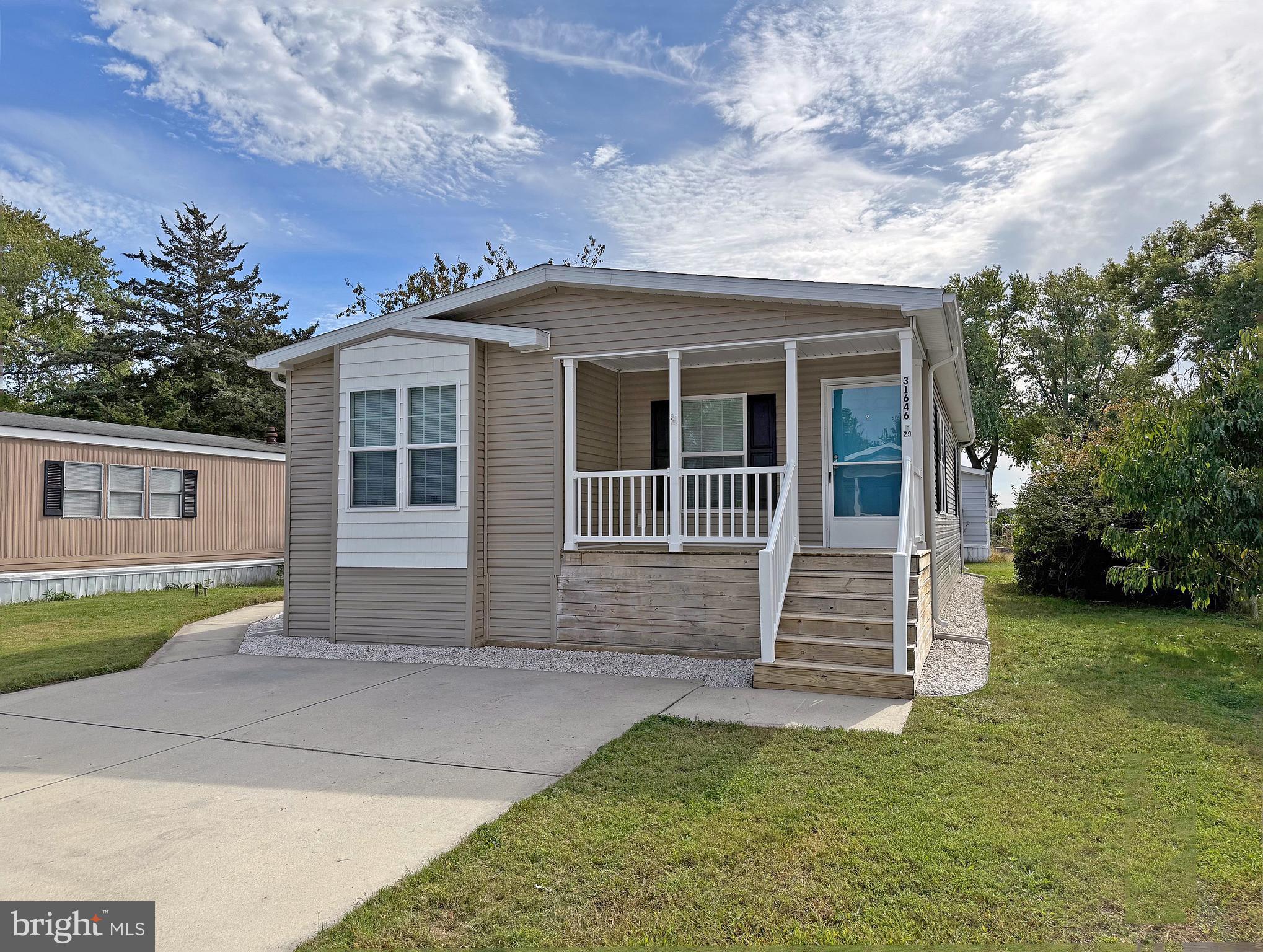31646 Janice Road, Unit C29 Lewes, DE 19958 - Photo 1 of 34 front view of a house with a yard