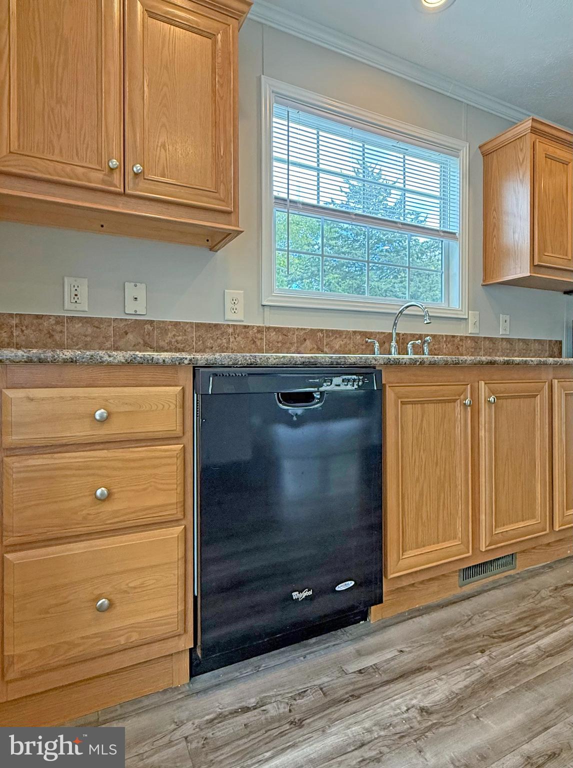 31646 Janice Road, Unit C29 Lewes, DE 19958 - Photo 11 of 34 a stove with granite countertop cabinets and window