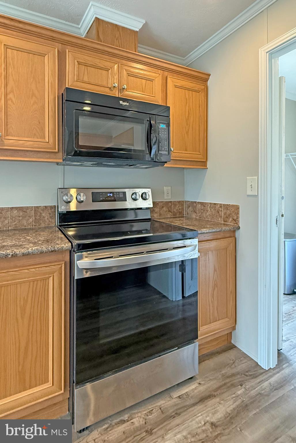 31646 Janice Road, Unit C29 Lewes, DE 19958 - Photo 12 of 34 a stove top oven sitting inside of a kitchen