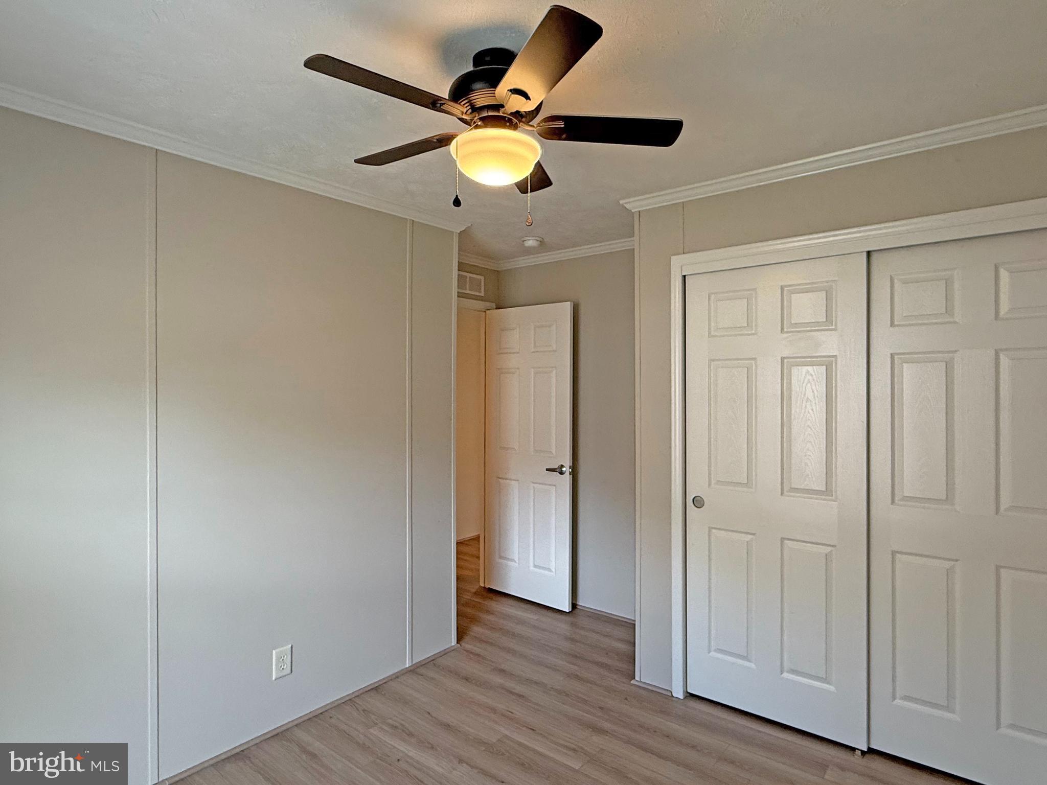 31646 Janice Road, Unit C29 Lewes, DE 19958 - Photo 22 of 34 an empty room with wooden floor