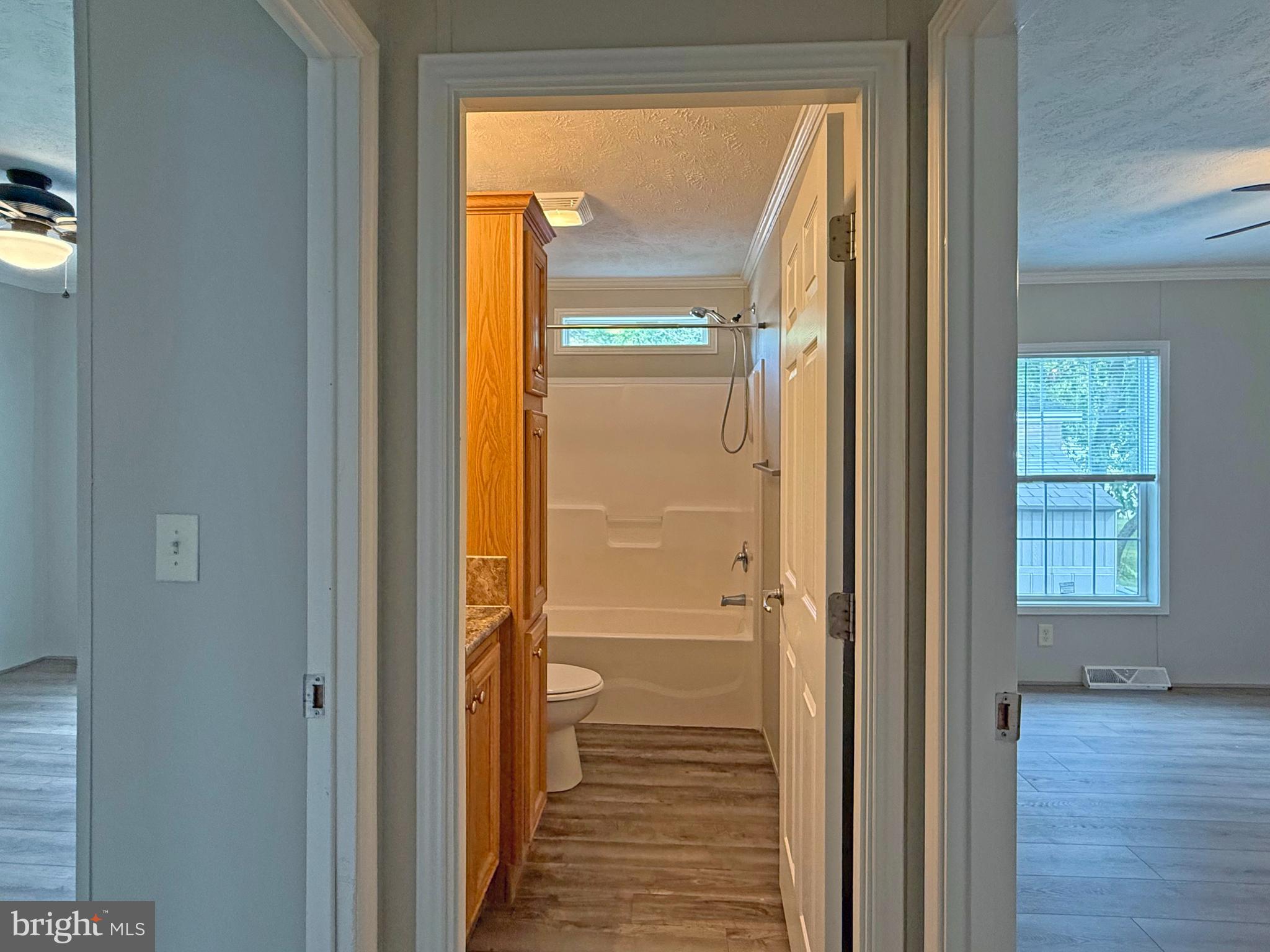 31646 Janice Road, Unit C29 Lewes, DE 19958 - Photo 23 of 34 a view of a bathroom with a glass door