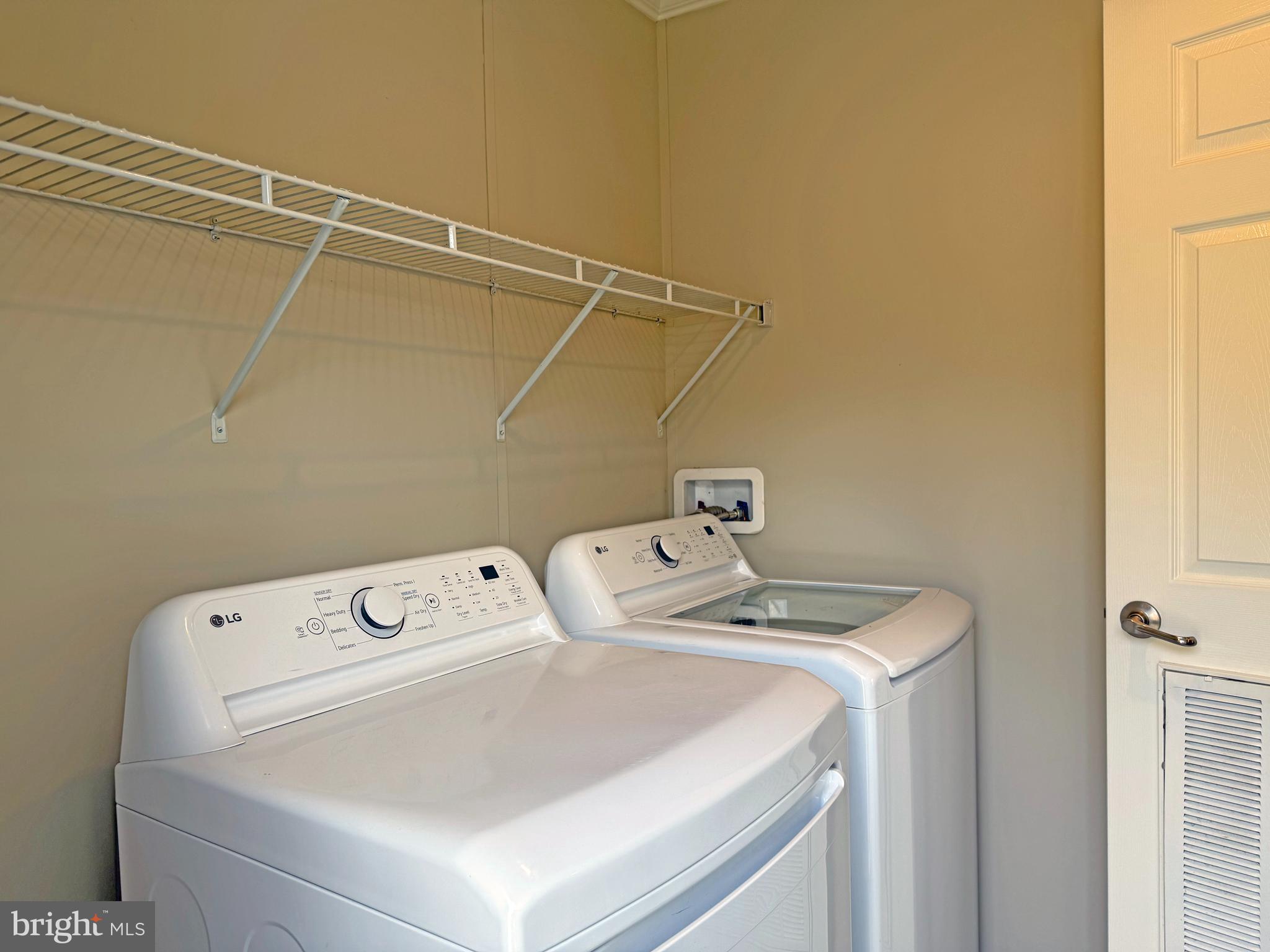 31646 Janice Road, Unit C29 Lewes, DE 19958 - Photo 25 of 34 a utility room with dryer and washer