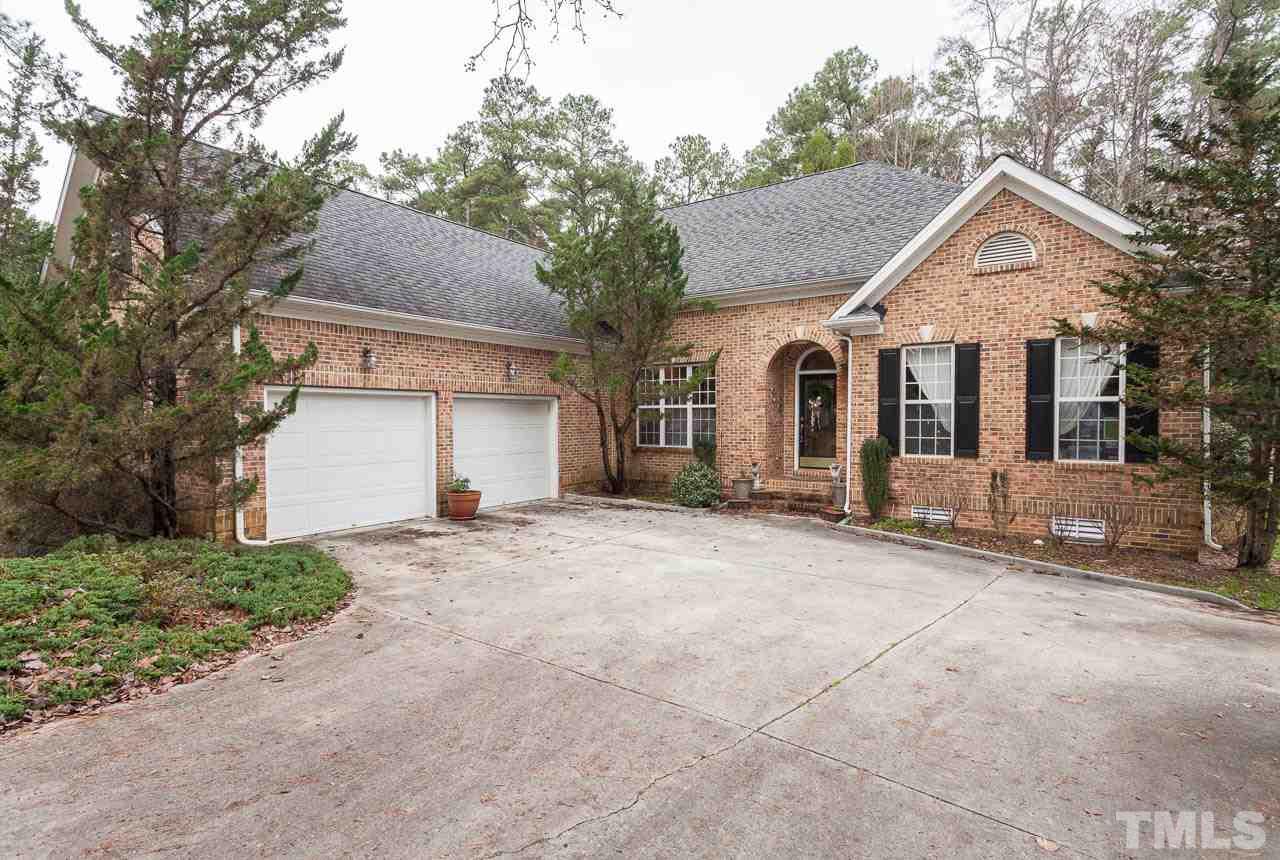 3400 Edgemont Drive Raleigh, NC 27612 - Photo 1 of 22 a front view of a house with a yard and garage