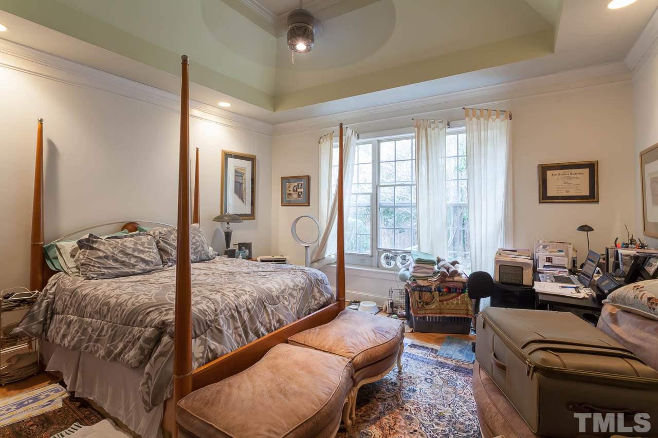 3400 Edgemont Drive Raleigh, NC 27612 - Photo 11 of 22 a bedroom with bed or couch and a large window