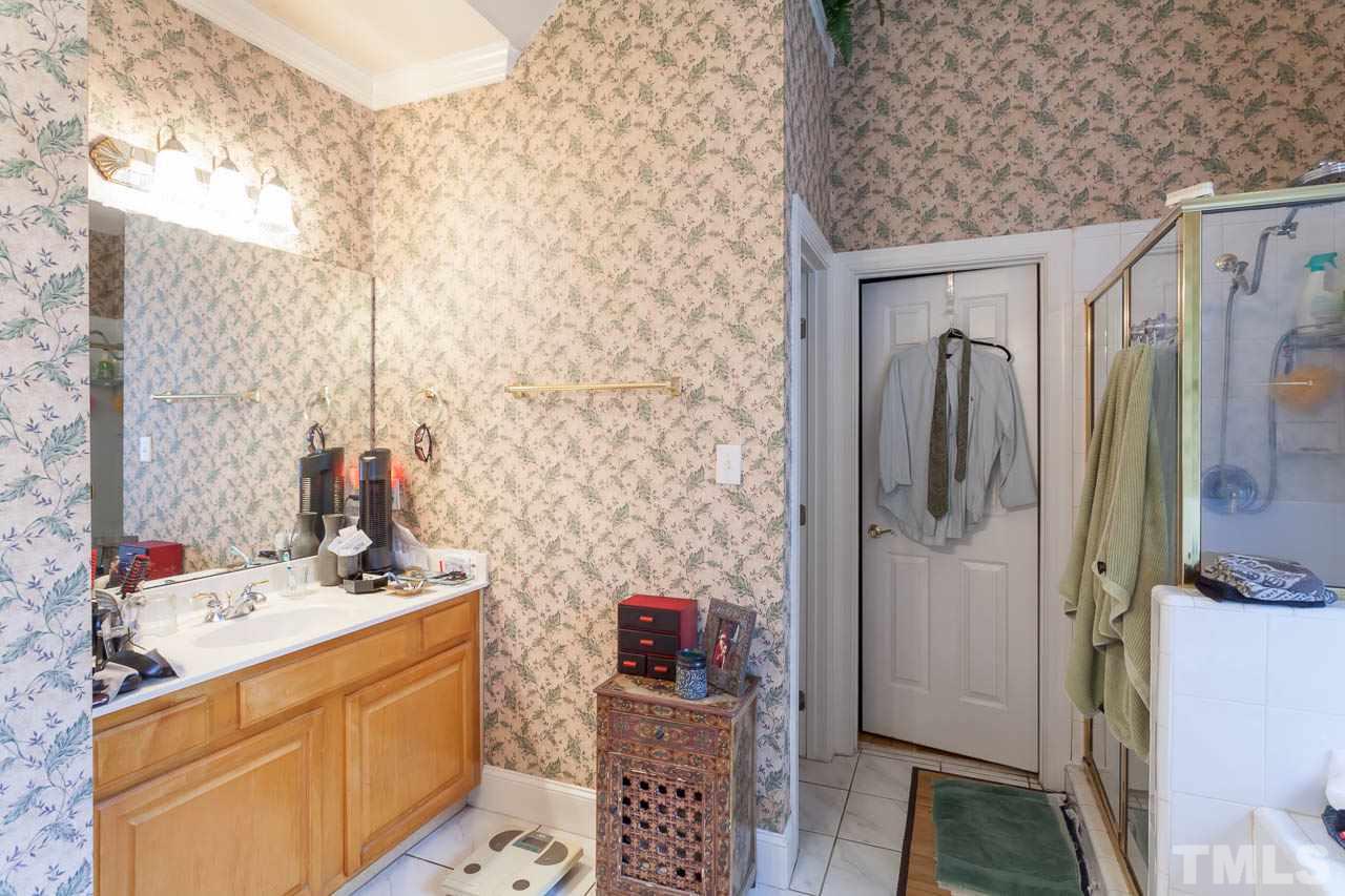 3400 Edgemont Drive Raleigh, NC 27612 - Photo 12 of 22 a bathroom with a sink toilet and shower