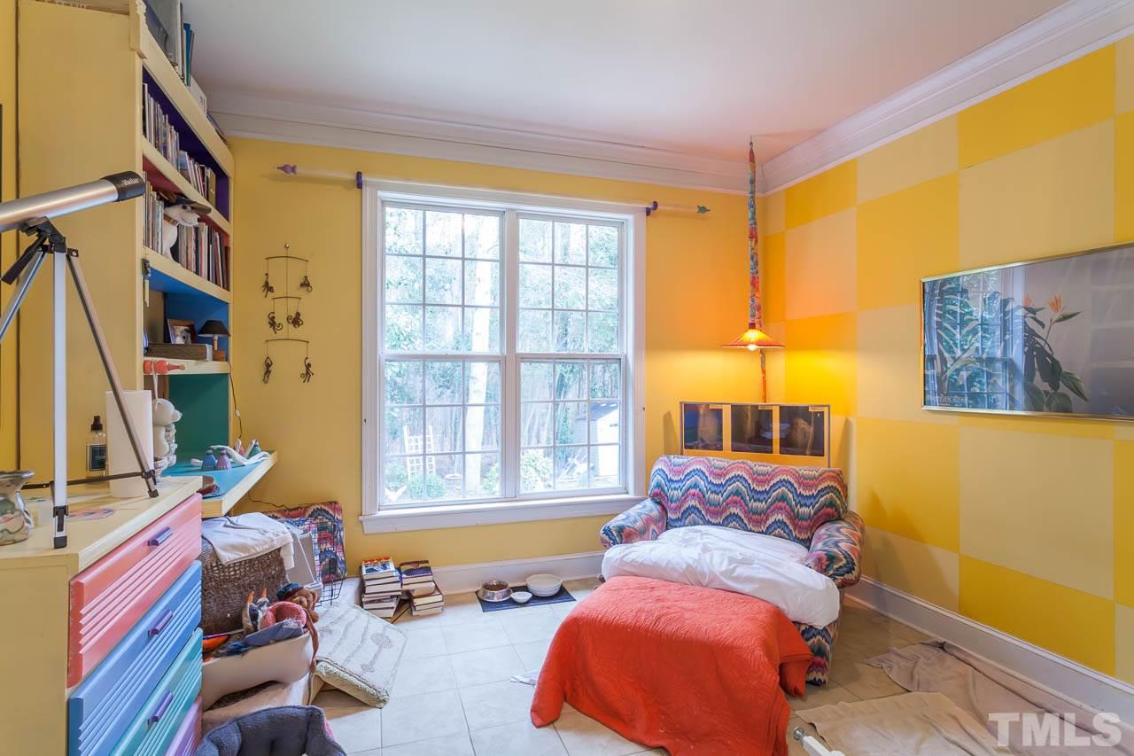 3400 Edgemont Drive Raleigh, NC 27612 - Photo 15 of 22 a bedroom with a bed and a window