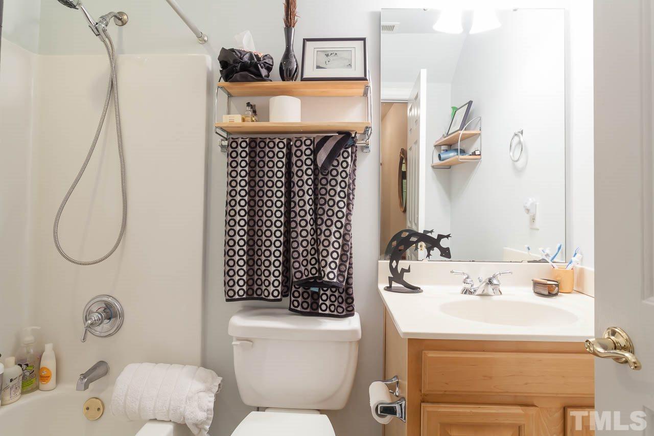 3400 Edgemont Drive Raleigh, NC 27612 - Photo 16 of 22 a bathroom with a sink toilet and shower