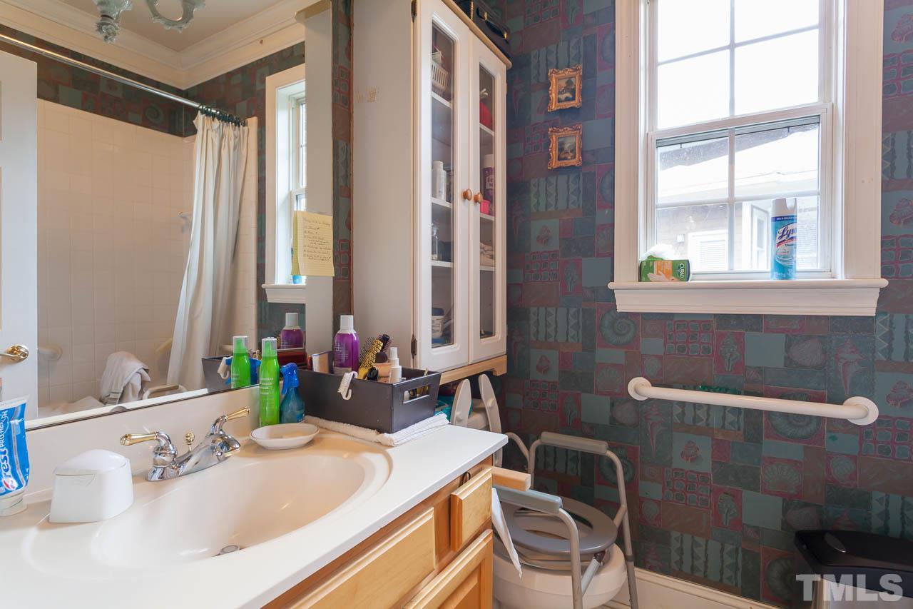 3400 Edgemont Drive Raleigh, NC 27612 - Photo 17 of 22 a bathroom with a sink and a mirror