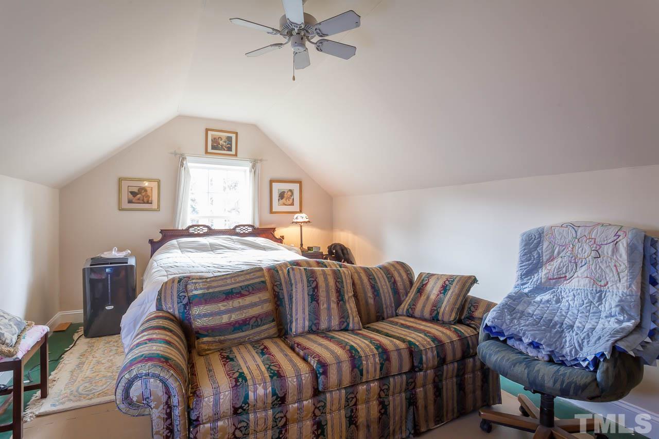 3400 Edgemont Drive Raleigh, NC 27612 - Photo 19 of 22 a bedroom with bed and a window