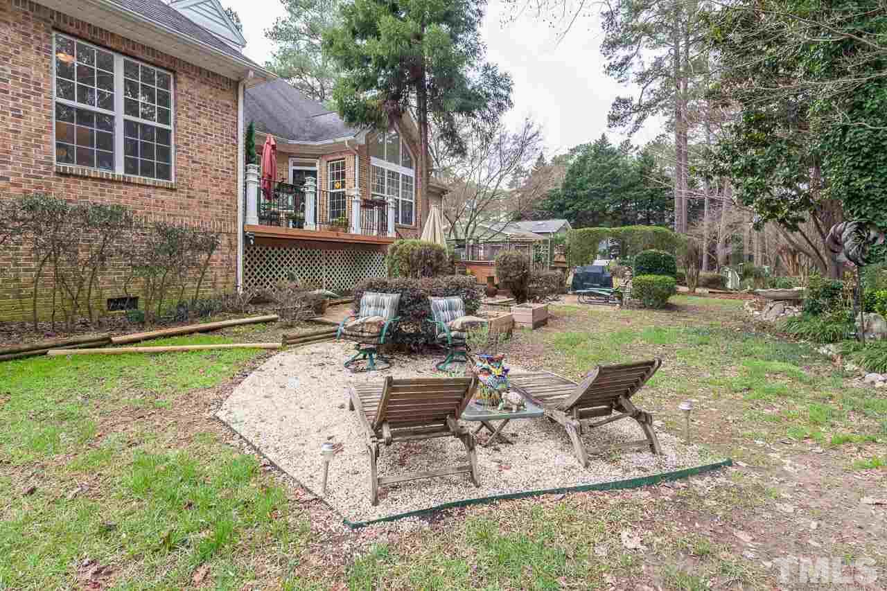 3400 Edgemont Drive Raleigh, NC 27612 - Photo 20 of 22 a view of a house with backyard and sitting area