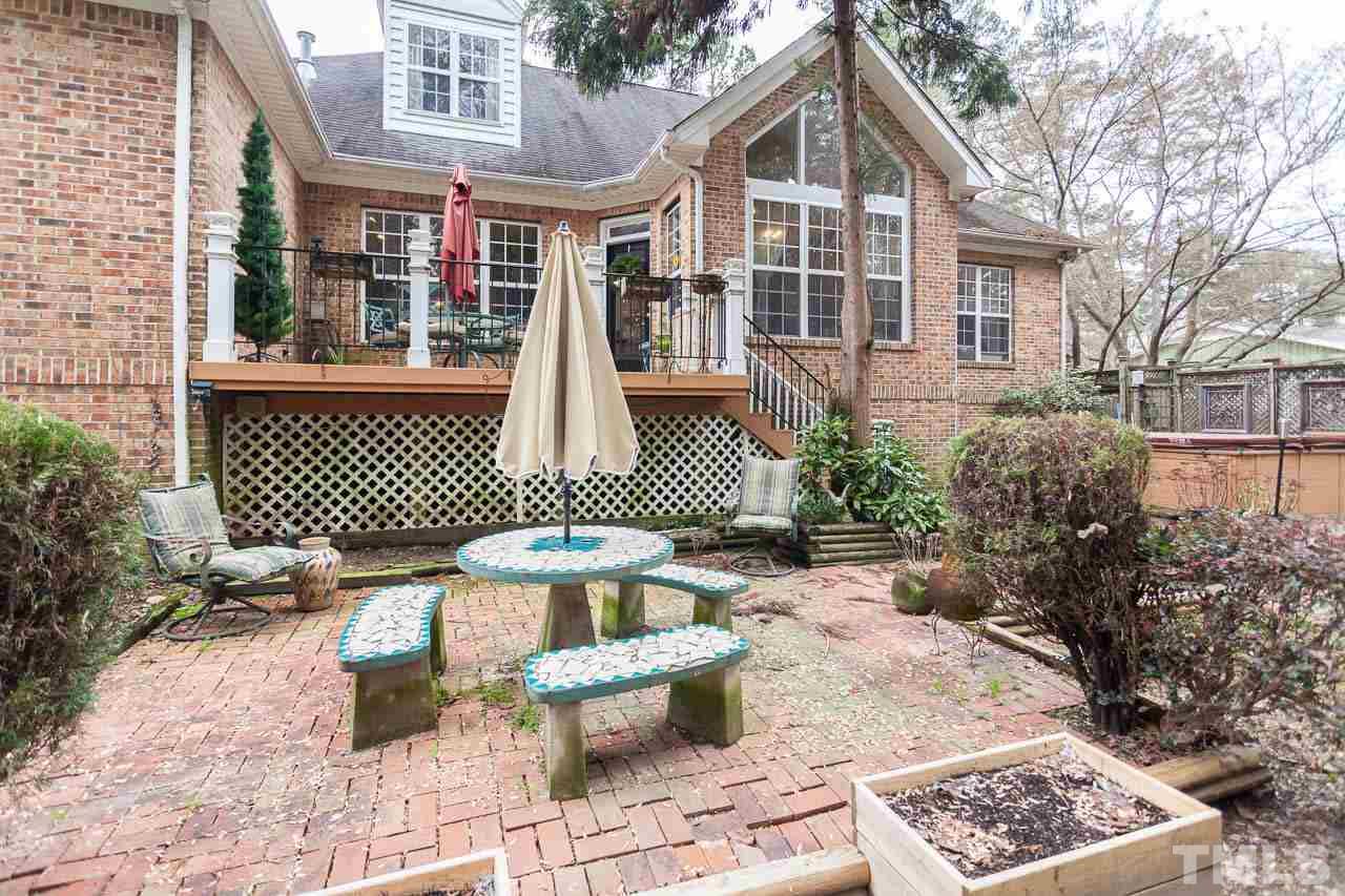3400 Edgemont Drive Raleigh, NC 27612 - Photo 21 of 22 a front view of a house with outdoor seating