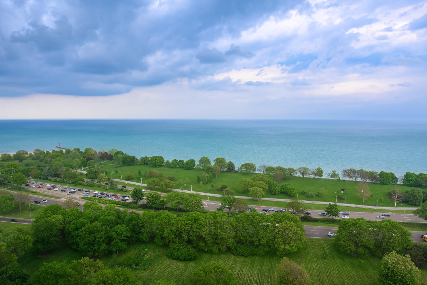 5445 North Sheridan Road, Unit 2708 Chicago, IL 60640 - Photo 12 of 16 a view of a city with lush green forest