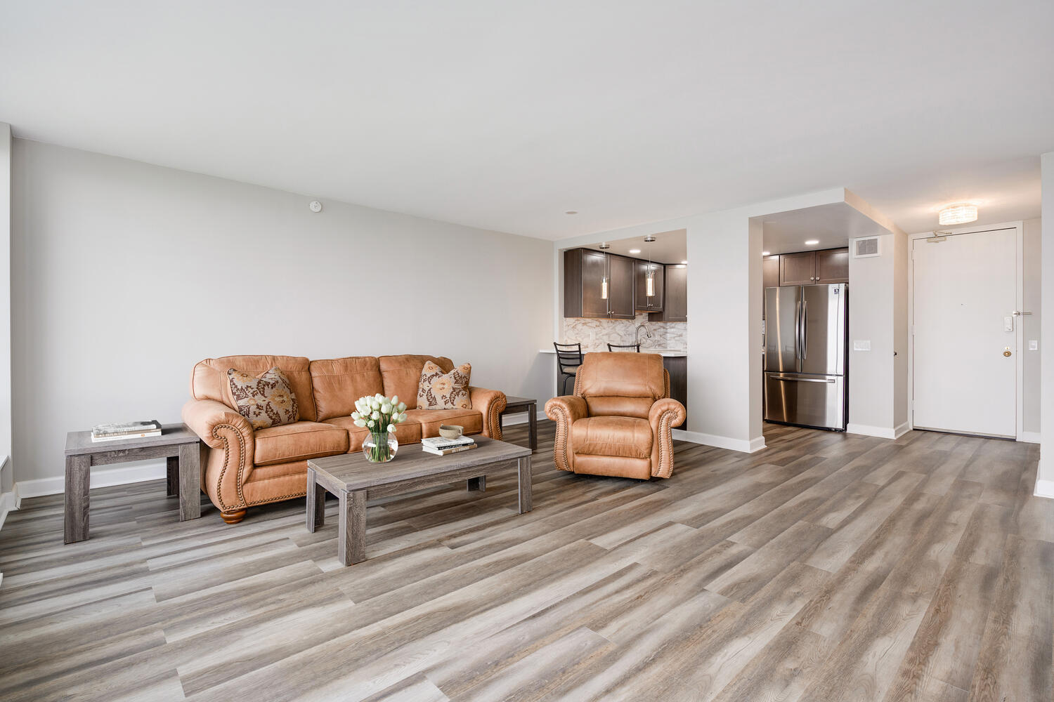 5445 North Sheridan Road, Unit 2708 Chicago, IL 60640 - Photo 9 of 16 a bedroom with furniture and wooden floor
