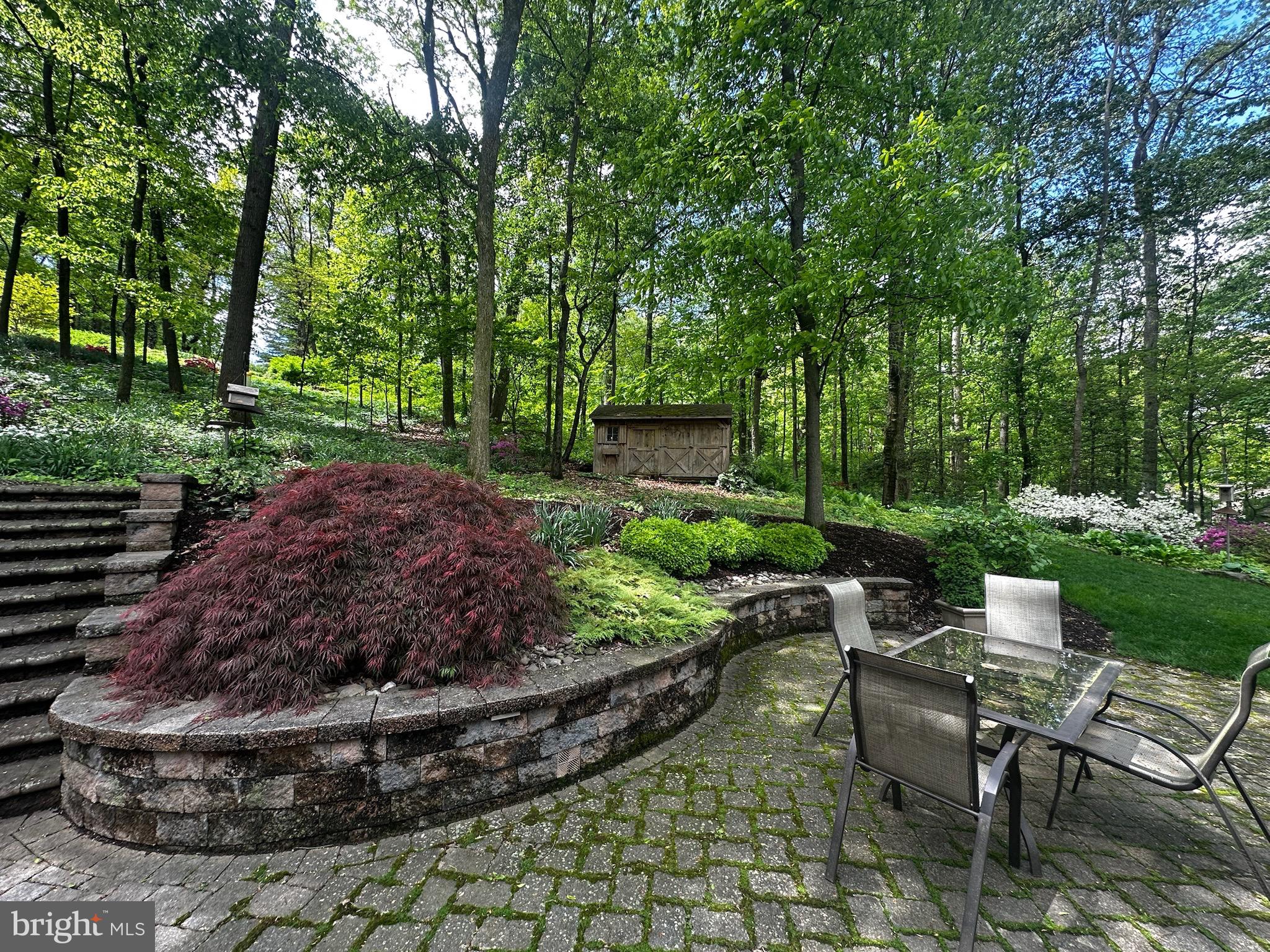 105 Northview Road Lititz, PA 17543 - Photo 11 of 38 a view of a backyard with sitting area and garden