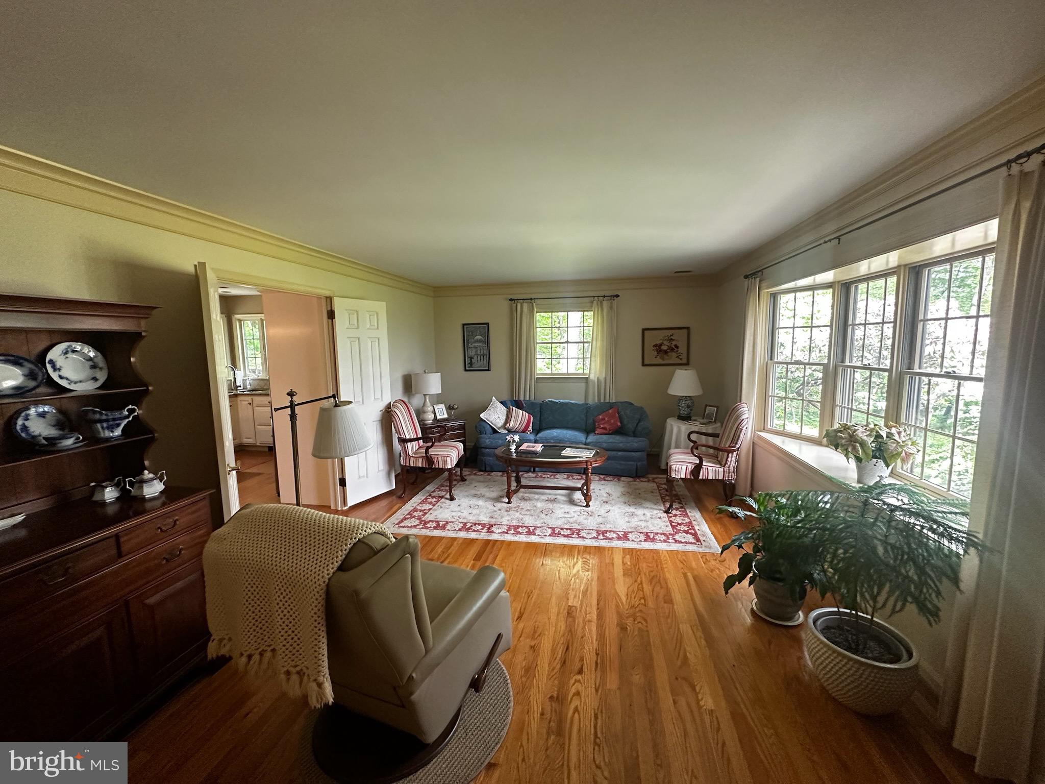 105 Northview Road Lititz, PA 17543 - Photo 18 of 38 a living room with furniture floor to ceiling window and potted plant