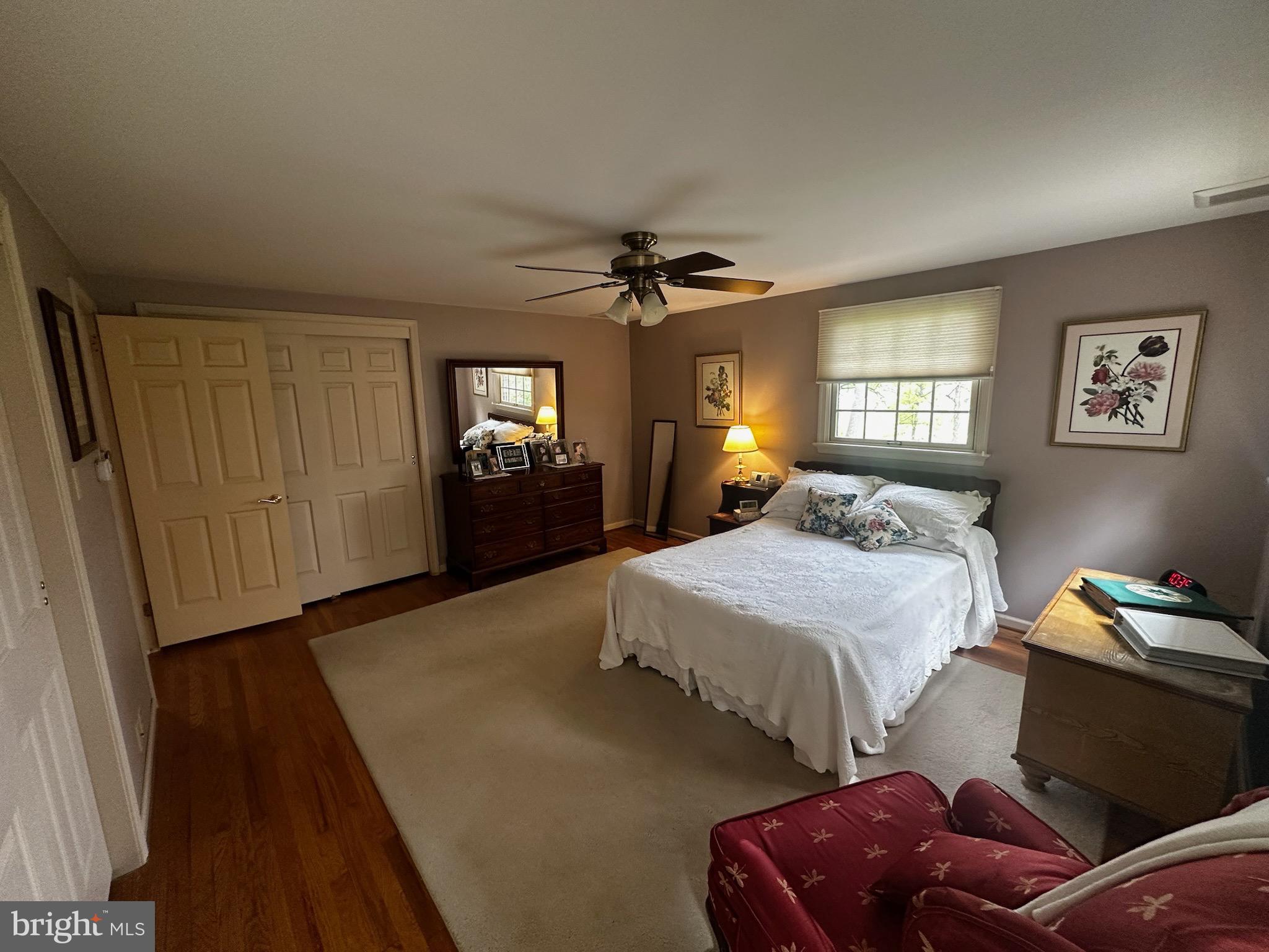 105 Northview Road Lititz, PA 17543 - Photo 30 of 38 a spacious bedroom with a bed and a chandelier