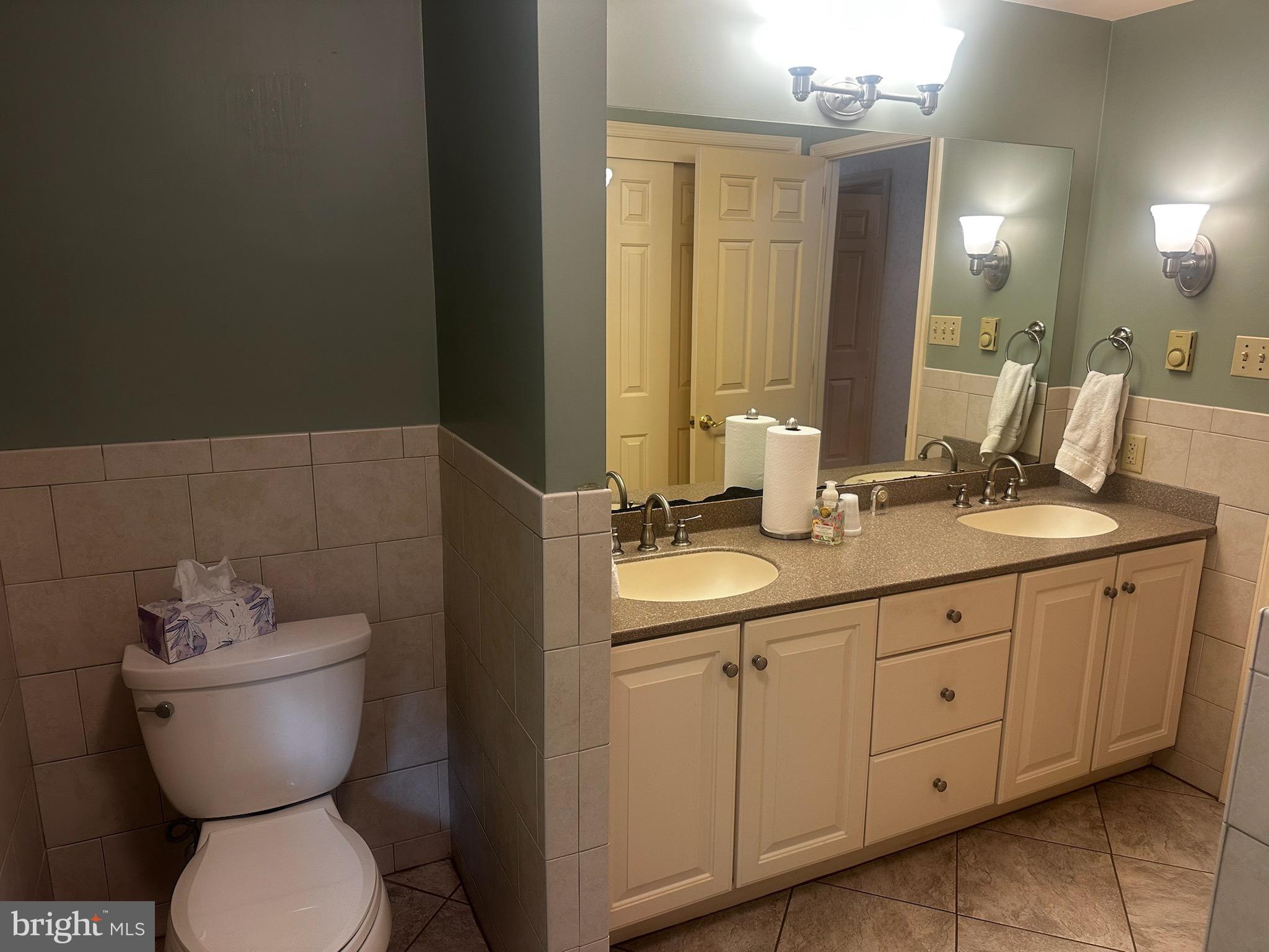 105 Northview Road Lititz, PA 17543 - Photo 36 of 38 a bathroom with a toilet sink and mirror